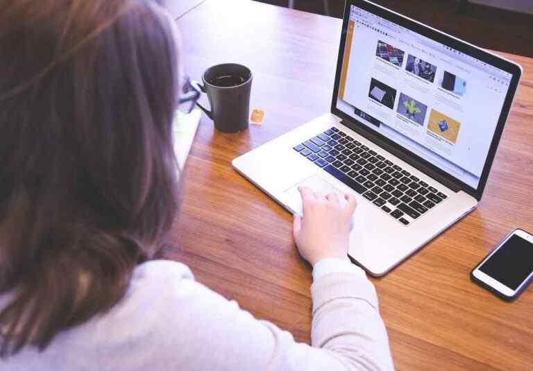 woman organising files on her laptop